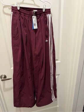 adidas Wide-Leg Track Pants in Burgundy with White Stripes